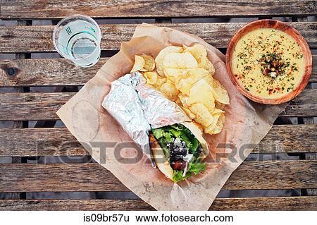 Meal of salad wrap, potato chips and dip View Large Photo Image Stock Photograph - Meal of salad wrap, potato chips and dip. Fotosearch