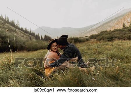 Mid adult couple sitting down hugging in rural valley, portrait, Mineral King, California, USA View Large Photo Image Stock Image - Mid adult couple sitting down hugging in rural valley, portrait, Mineral King, California, USA. Fotosearch