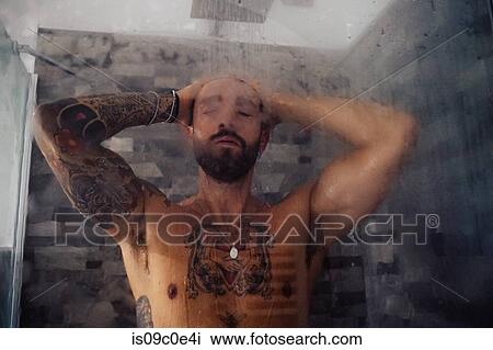 Mid adult man with tattooed chest in shower View Large Photo Image Stock Image - Mid adult man with tattooed chest in shower. Fotosearch