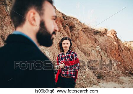 Mid adult woman looking at boyfriend on beach, Odessa Oblast, Ukraine View Large Photo Image Stock Photograph - Mid adult woman looking at boyfriend on beach, Odessa Oblast, Ukraine. Fotosearch