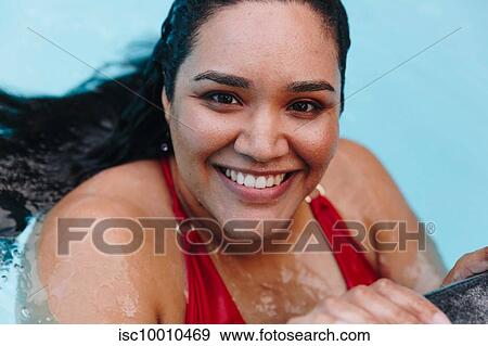Mid adult woman with wet hair holding onto outdoor swimming poolside, head and shoulder portrait, Cape Town, South Africa View Large Photo Image Stock Photo - Mid adult woman with wet hair holding onto outdoor swimming poolside, head and shoulder portrait, Cape Town, South Africa. Fotosearch