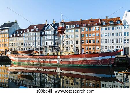 Moored boat with 17th century town houses on Nyhavn canal, Copenhagen, Denmark View Large Photo Image Stock Image - Moored boat with 17th century town houses on Nyhavn canal, Copenhagen, Denmark. Fotosearch