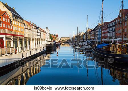 Moored restaurant boat and colourful 17th century town houses on Nyhavn canal, Copenhagen, Denmark View Large Photo Image Stock Image - Moored restaurant boat and colourful 17th century town houses on Nyhavn canal, Copenhagen, Denmark. Fotosearch
