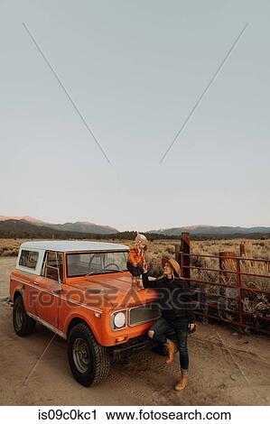 Mother and baby girl bonding by off road vehicle, Kennedy Meadows, California, US View Large Photo Image Stock Image - Mother and baby girl bonding by off road vehicle, Kennedy Meadows, California, US. Fotosearch
