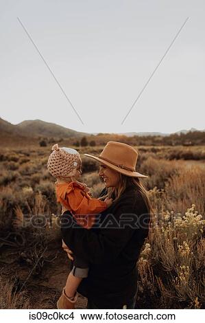 Mother and baby girl bonding, Kennedy Meadows, California, US View Large Photo Image Picture - Mother and baby girl bonding, Kennedy Meadows, California, US. Fotosearch