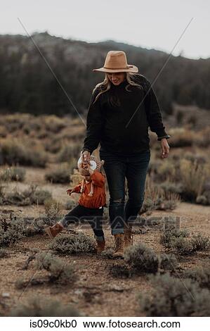 Stock Image - Mother and baby girl bonding, Kennedy Meadows, California, US. Fotosearch