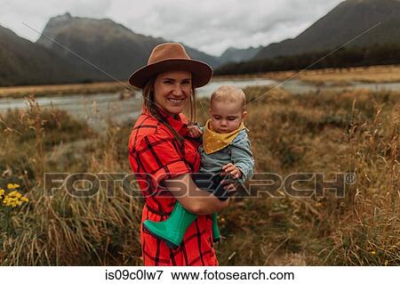 Stock Photo - Mother and baby in wilderness by lake, Queenstown, Canterbury, New Zealand. Fotosearch
