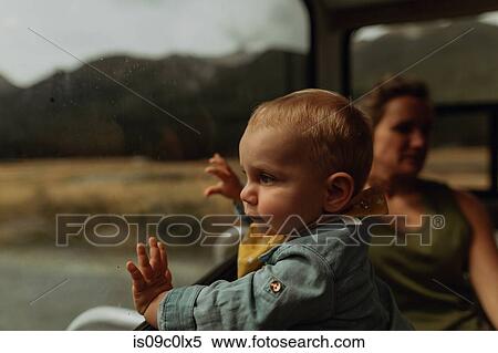 Stock Photography - Mother and baby relaxing in motorhome, Queenstown, Canterbury, New Zealand. Fotosearch