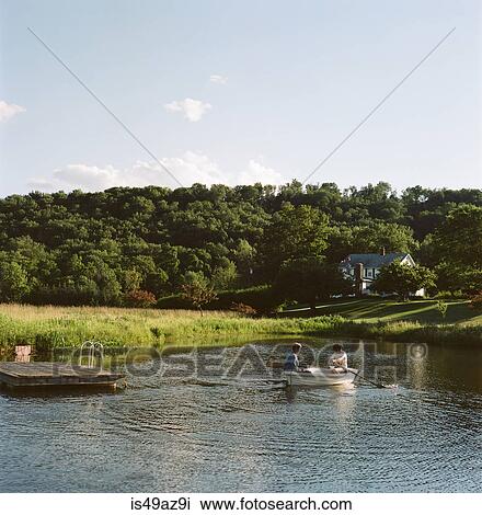 Mother and daughter in rowing boat, on water View Large Photo Image Stock Image - Mother and daughter in rowing boat, on water. Fotosearch