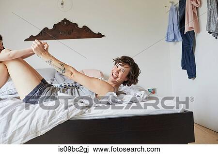 Mother and daughter playing in bedroom View Large Photo Image Stock Image - Mother and daughter playing in bedroom. Fotosearch