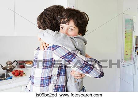 Mother and son at home, hugging View Large Photo Image Stock Image - Mother and son at home, hugging. Fotosearch