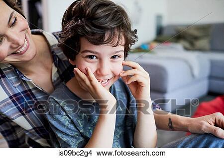 Mother and son at home, smiling View Large Photo Image Picture - Mother and son at home, smiling. Fotosearch