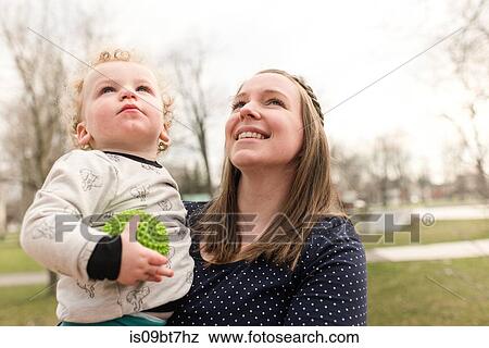 Stock Photo - Mother and son in park. Fotosearch