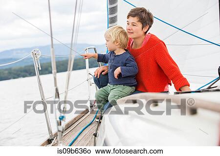 Mother and son on sailing boat, looking at view, Geneva, Switzerland, Europe View Large Photo Image Picture - Mother and son on sailing boat, looking at view, Geneva, Switzerland, Europe. Fotosearch
