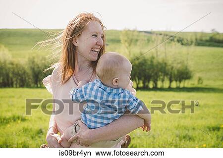 Mother and son taking walk in park View Large Photo Image Picture - Mother and son taking walk in park. Fotosearch