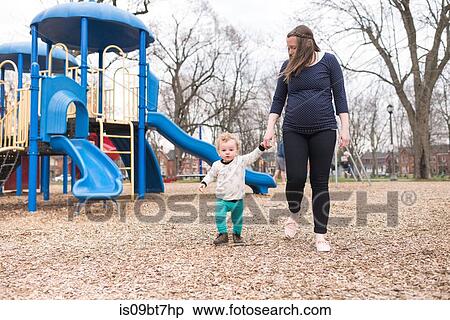 Mother and son walking in park View Large Photo Image Stock Photography - Mother and son walking in park. Fotosearch