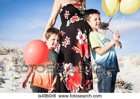 Stock Photo - Mother and sons on beach, Cape Town, South Africa. Fotosearch