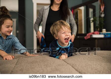 Mother playing with children at home View Large Photo Image Stock Image - Mother playing with children at home. Fotosearch