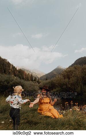 Mother reaching out for toddler daughter's hand in rural valley, Mineral King, California, USA View Large Photo Image Stock Image - Mother reaching out for toddler daughter's hand in rural valley, Mineral King, California, USA. Fotosearch