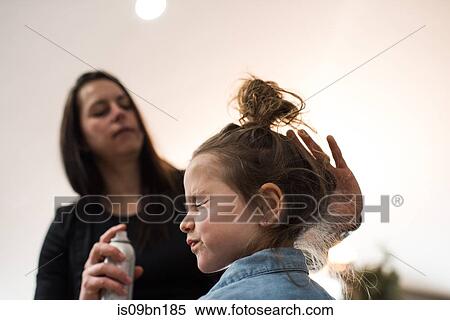 Mother tidying daughter's hair View Large Photo Image Stock Photography - Mother tidying daughter's hair. Fotosearch