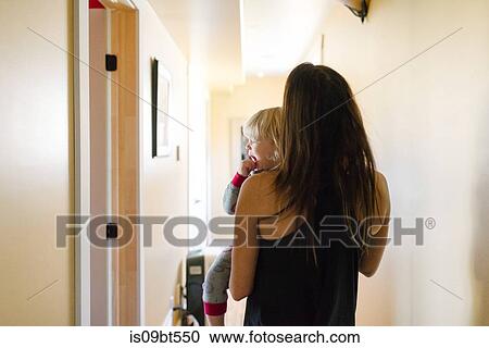 Mother with crying son at home View Large Photo Image Stock Image - Mother with crying son at home. Fotosearch