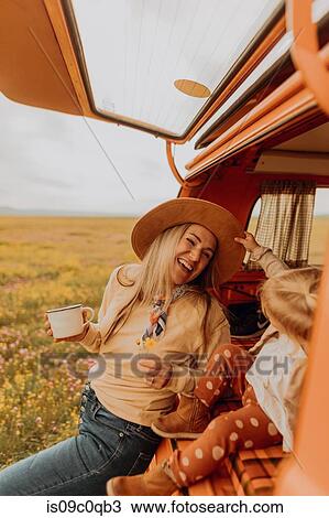Stock Image - Mother with daughter on road trip in countryside. Fotosearch