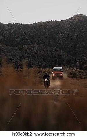 Motorbiker and off road vehicle going through landscape of Kennedy Meadows, California, US View Large Photo Image Stock Image - Motorbiker and off road vehicle going through landscape of Kennedy Meadows, California, US. Fotosearch