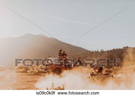 Motorbiker raising dust, friends watching in background, Kennedy Meadows, California, US View Large Photo Image Stock Image - Motorbiker raising dust, friends watching in background, Kennedy Meadows, California, US. Fotosearch