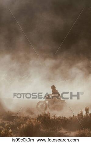 Motorbiker raising dust, Kennedy Meadows, California, US View Large Photo Image Picture - Motorbiker raising dust, Kennedy Meadows, California, US. Fotosearch