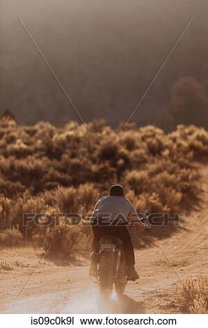 Motorbiker raising dust, Kennedy Meadows, California, US View Large Photo Image Stock Image - Motorbiker raising dust, Kennedy Meadows, California, US. Fotosearch