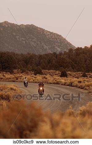 Motorbikers riding through landscape of Kennedy Meadows, California, US View Large Photo Image Stock Photo - Motorbikers riding through landscape of Kennedy Meadows, California, US. Fotosearch