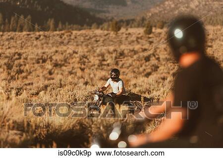 Motorbikers riding through landscape of Kennedy Meadows, California, US View Large Photo Image Stock Photography - Motorbikers riding through landscape of Kennedy Meadows, California, US. Fotosearch