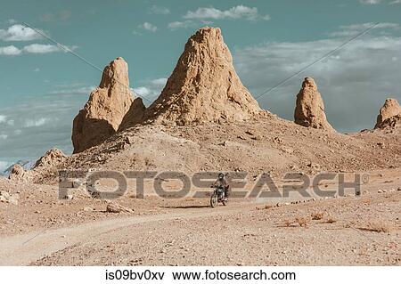 Motorcyclist riding in desert, Trona Pinnacles, California, US View Large Photo Image Stock Photo - Motorcyclist riding in desert, Trona Pinnacles, California, US. Fotosearch