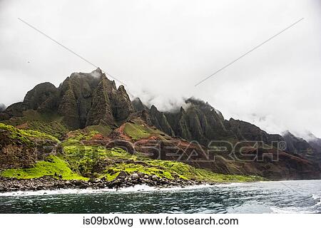 Mountains by sea, Na Pali Coast, Kauai, Hawaii View Large Photo Image Stock Image - Mountains by sea, Na Pali Coast, Kauai, Hawaii. Fotosearch