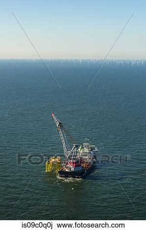 New transformer stations under construction in preparation for the Borselle windfield expansion, aerial view, Domburg, Zeeland, Netherlands View Large Photo Image Stock Image - New transformer stations under construction in preparation for the Borselle windfield expansion, aerial view, Domburg, Zeeland, Netherlands. Fotosearch