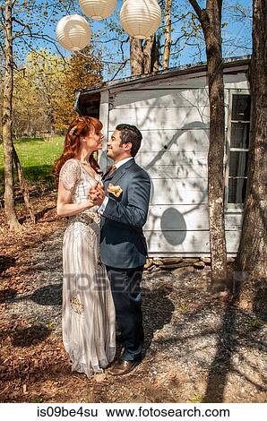 Newly married millennial couple has first dance View Large Photo Image Stock Photograph - Newly married millennial couple has first dance. Fotosearch