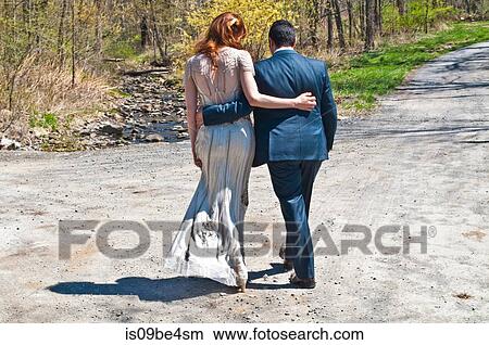 Newlywed couple on path View Large Photo Image Picture - Newlywed couple on path. Fotosearch
