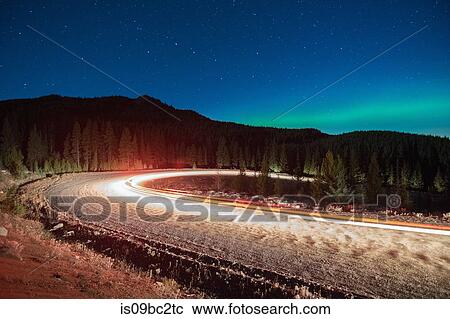 Northern lights, and long exposure light trails from vehicles on road, Nickel Plate Provincial Park, Penticton, British Columbia, Canada View Large Photo Image Stock Image - Northern lights, and long exposure light trails from vehicles on road, Nickel Plate Provincial Park, Penticton, British Columbia, Canada. Fotosearch