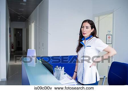 Nurse waiting at hospital reception View Large Photo Image Stock Photo - Nurse waiting at hospital reception. Fotosearch