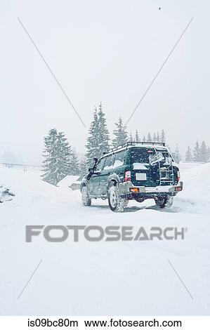 Off-road vehicle on snow-covered field, Gurne, Ukraine View Large Photo Image Picture - Off-road vehicle on snow-covered field, Gurne, Ukraine. Fotosearch
