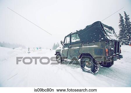 Off-road vehicle on snow-covered field, Gurne, Ukraine View Large Photo Image Picture - Off-road vehicle on snow-covered field, Gurne, Ukraine. Fotosearch