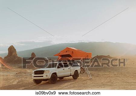 Stock Photo - Off road vehicle with tent, Trona Pinnacles, California, US. Fotosearch