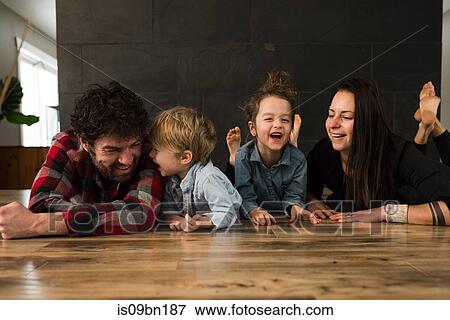 Parents and children playing on floor View Large Photo Image Stock Photo - Parents and children playing on floor. Fotosearch