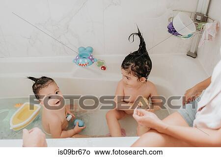 Parents with daughter at bath time View Large Photo Image Picture - Parents with daughter at bath time. Fotosearch