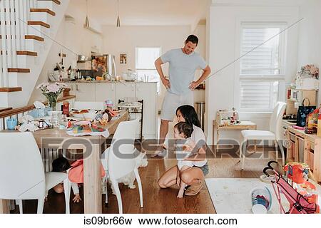 Parents with daughters at home View Large Photo Image Stock Photo - Parents with daughters at home. Fotosearch
