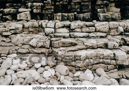Pebbles, uneven layers of stone and rocks View Large Photo Image Picture - Pebbles, uneven layers of stone and rocks. Fotosearch