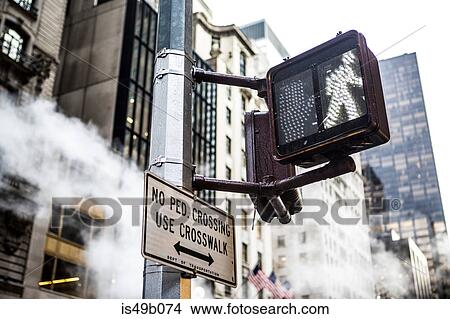 Pedestrian crossing sign and skyscrapers, New York City, USA View Large Photo Image Picture - Pedestrian crossing sign and skyscrapers, New York City, USA. Fotosearch