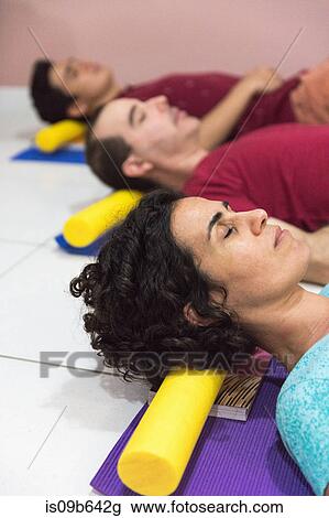 People at yoga class resting head on block View Large Photo Image Stock Image - People at yoga class resting head on block. Fotosearch
