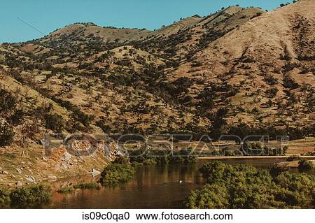 Stock Image - People in background kayaking in lake, Kaweah, California, United States. Fotosearch