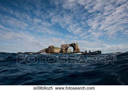 People in boat by Darwin's arch, Darwin Island, Seymour, Galapagos, Ecuador, South America View Large Photo Image Stock Photography - People in boat by Darwin's arch, Darwin Island, Seymour, Galapagos, Ecuador, South America. Fotosearch